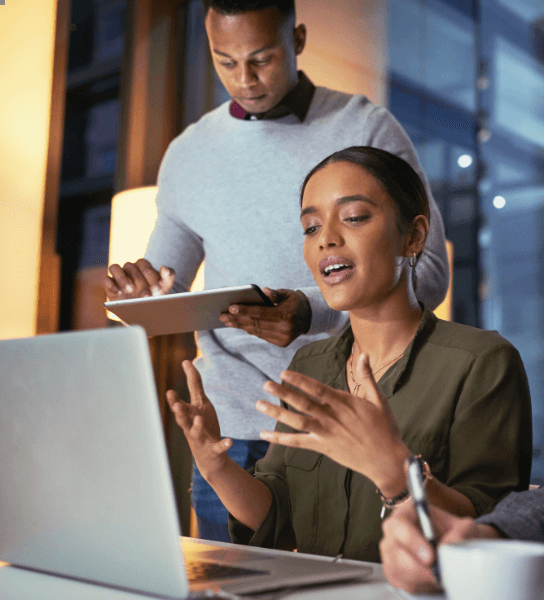 man teaching woman about work