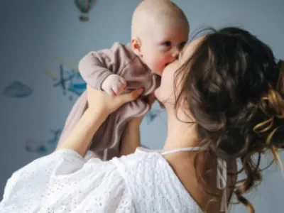 woman holding her child